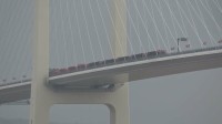 中国と北朝鮮を結ぶ自動車橋で開通式典始まる　現場では両国国旗のトラックや大勢の見物人 完成から12年未開通